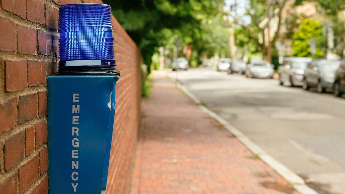 Blue emergency alert on a wall