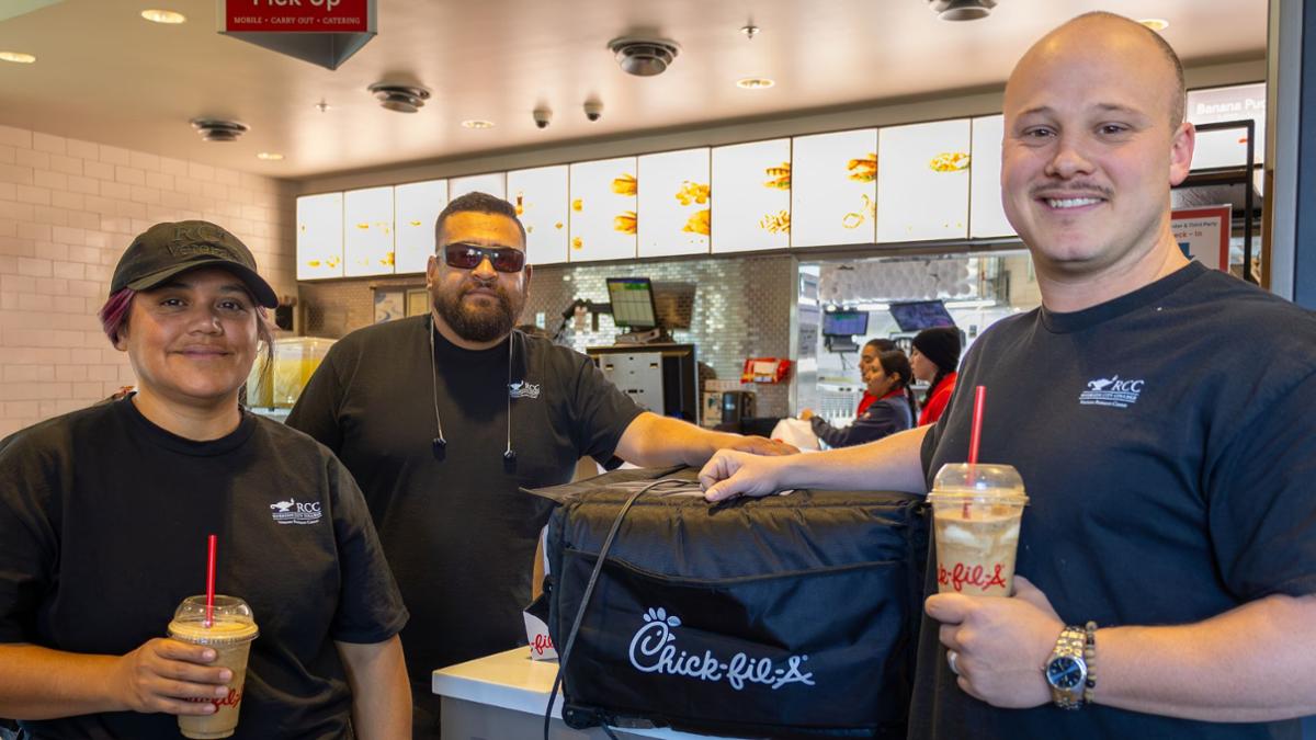 student with chickfla at veterans event 