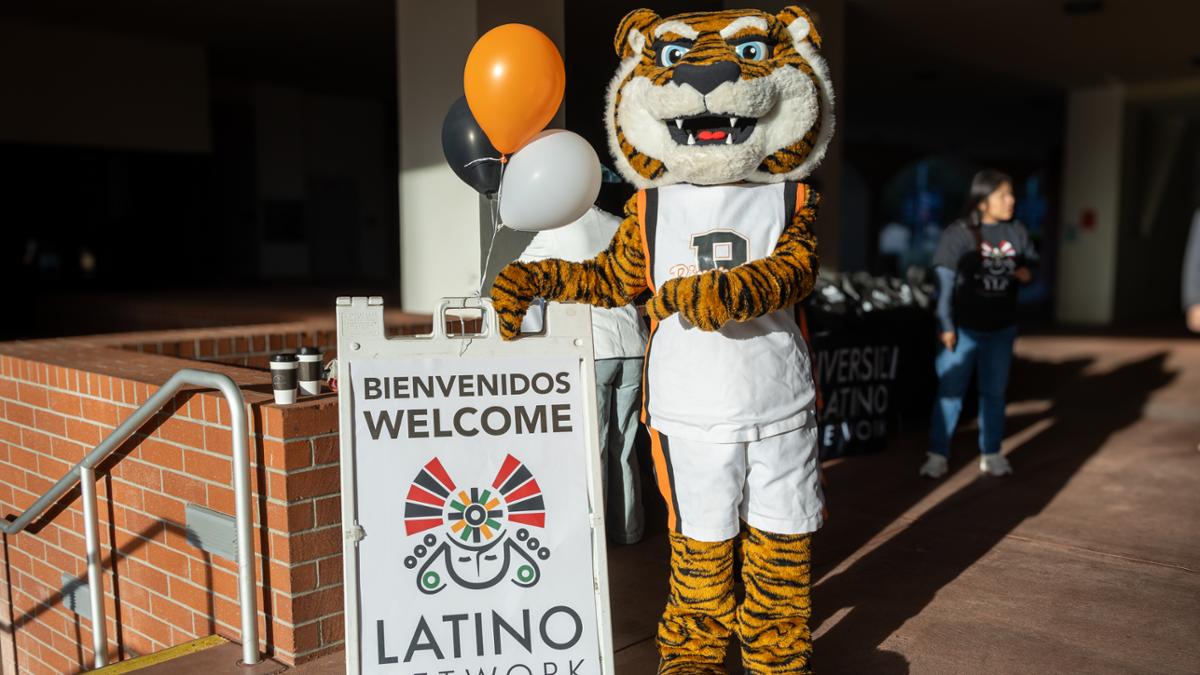 Benny the Bengal with a Latino Youth Conference Sign- orange and black cartoons