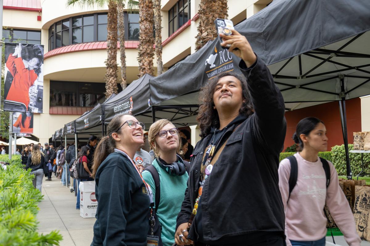 Student with a professor taking a selfie