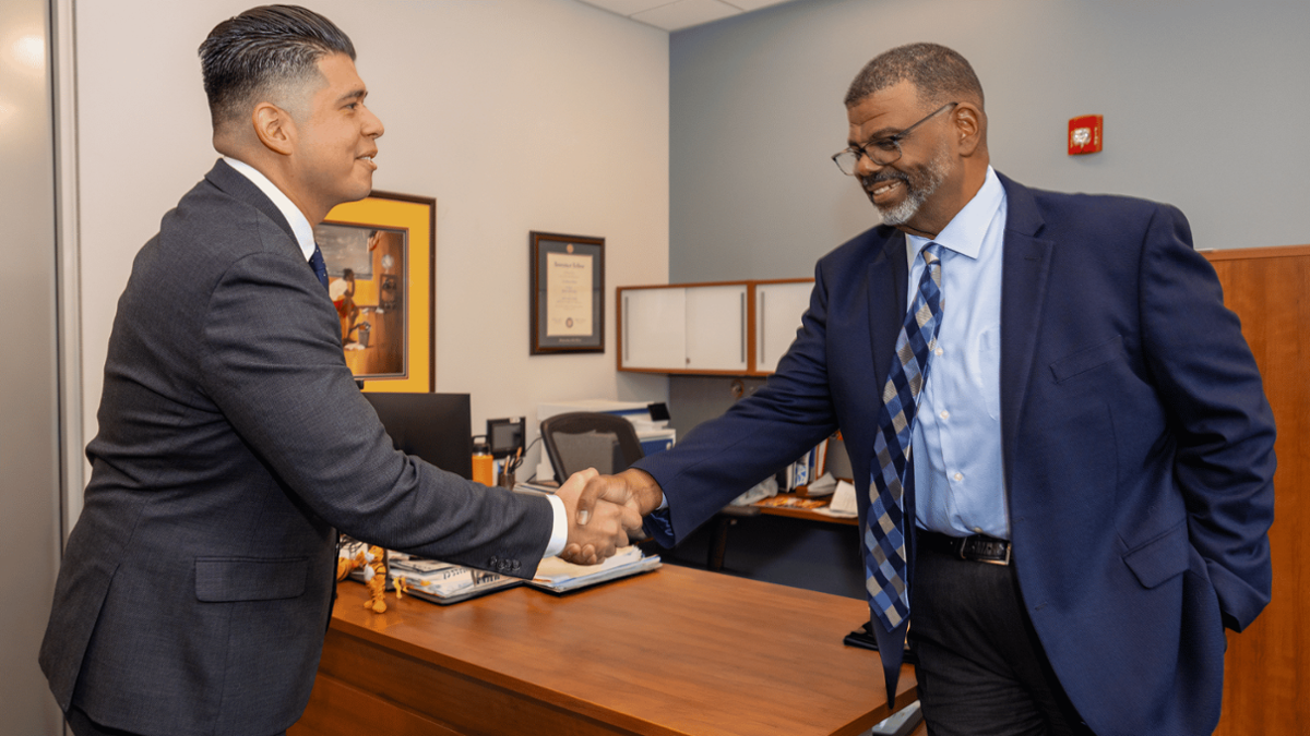 james and dr.bishop shaking hands