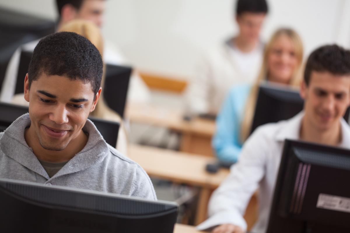 students looking at computer