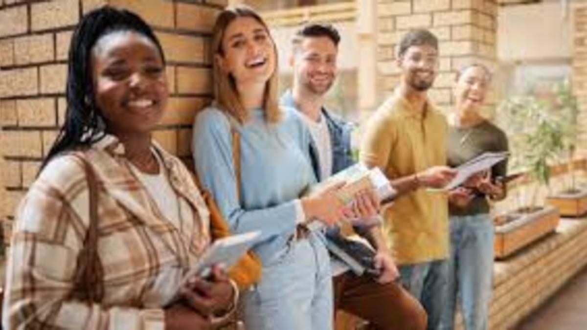 Students laughing and looking at the camera