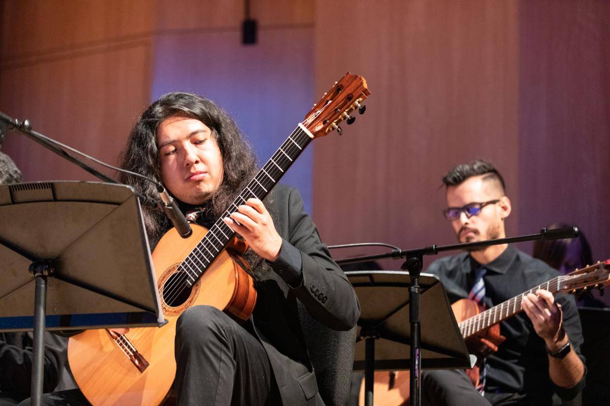 Students playing the guitar